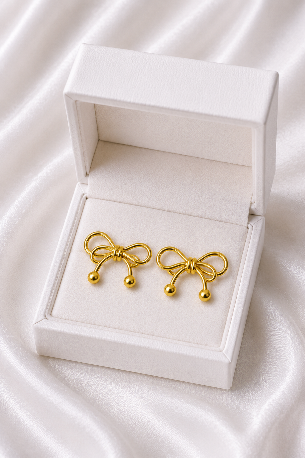 Golden Bow Stud Earrings – Elegant Minimal Design